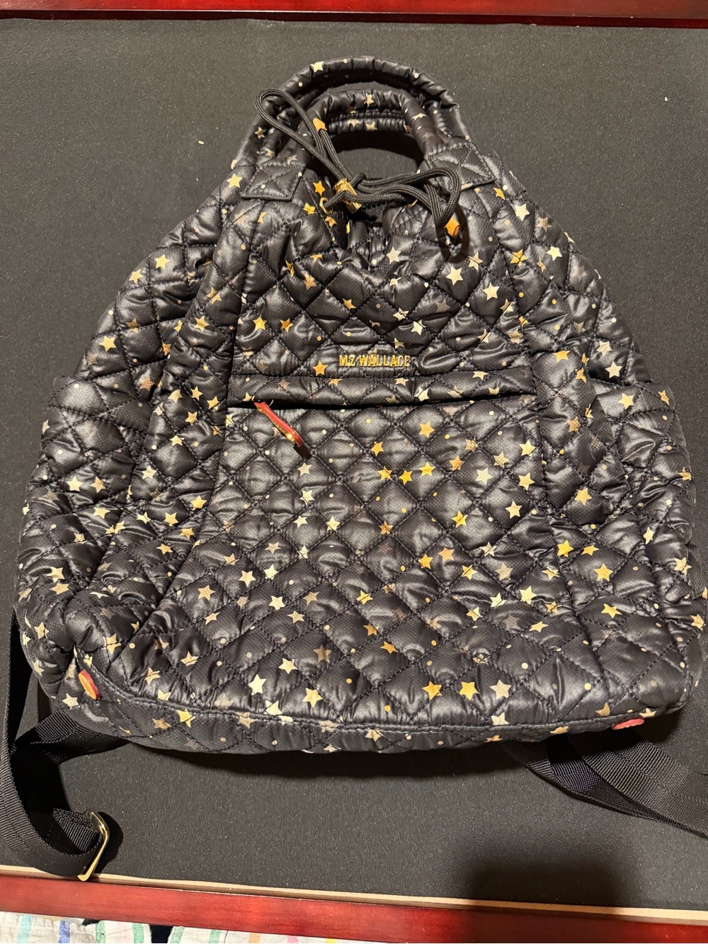 MZ Wallace star quilted large backpack gold and black